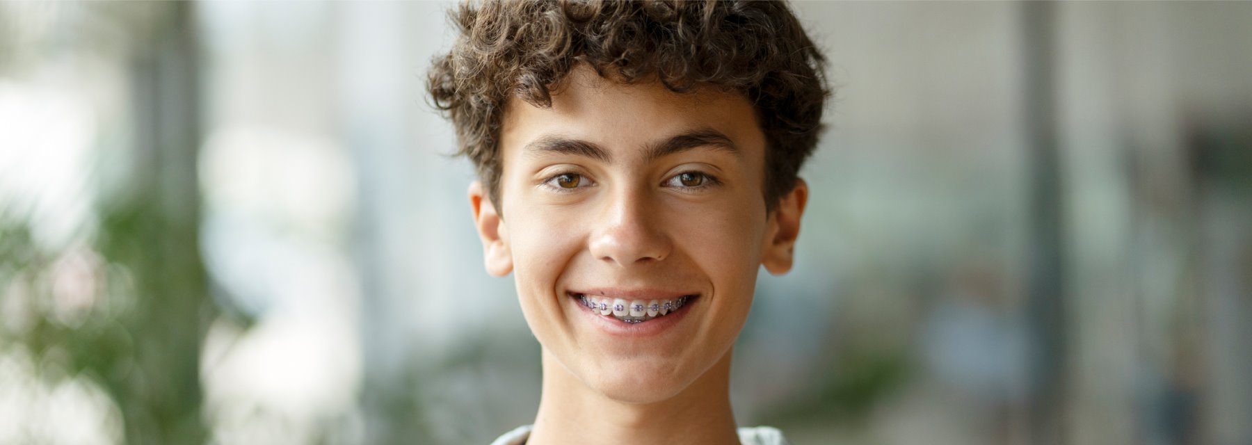 Smiling Young Man With Curly Hair at Charleston West Virginia