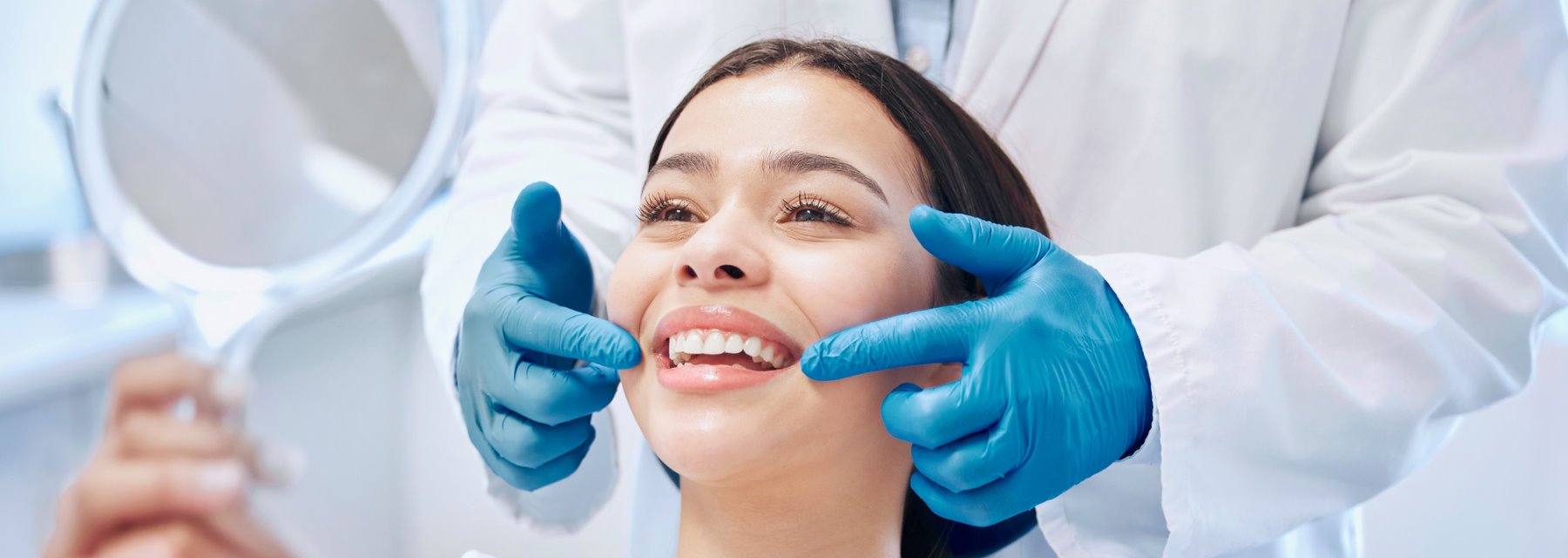 Woman Receiving A Dental Cleaning From A Dentist at Charleston West Virginia