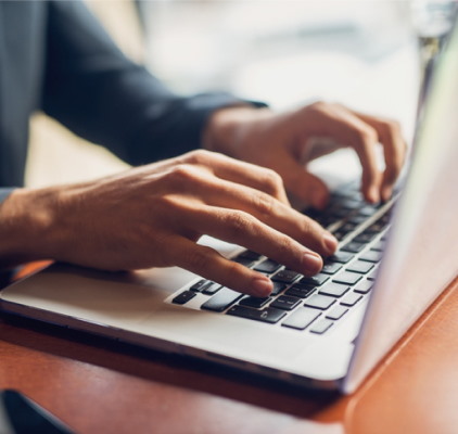 Person Focused On Typing On A Laptop Computer at Charleston West Virginia